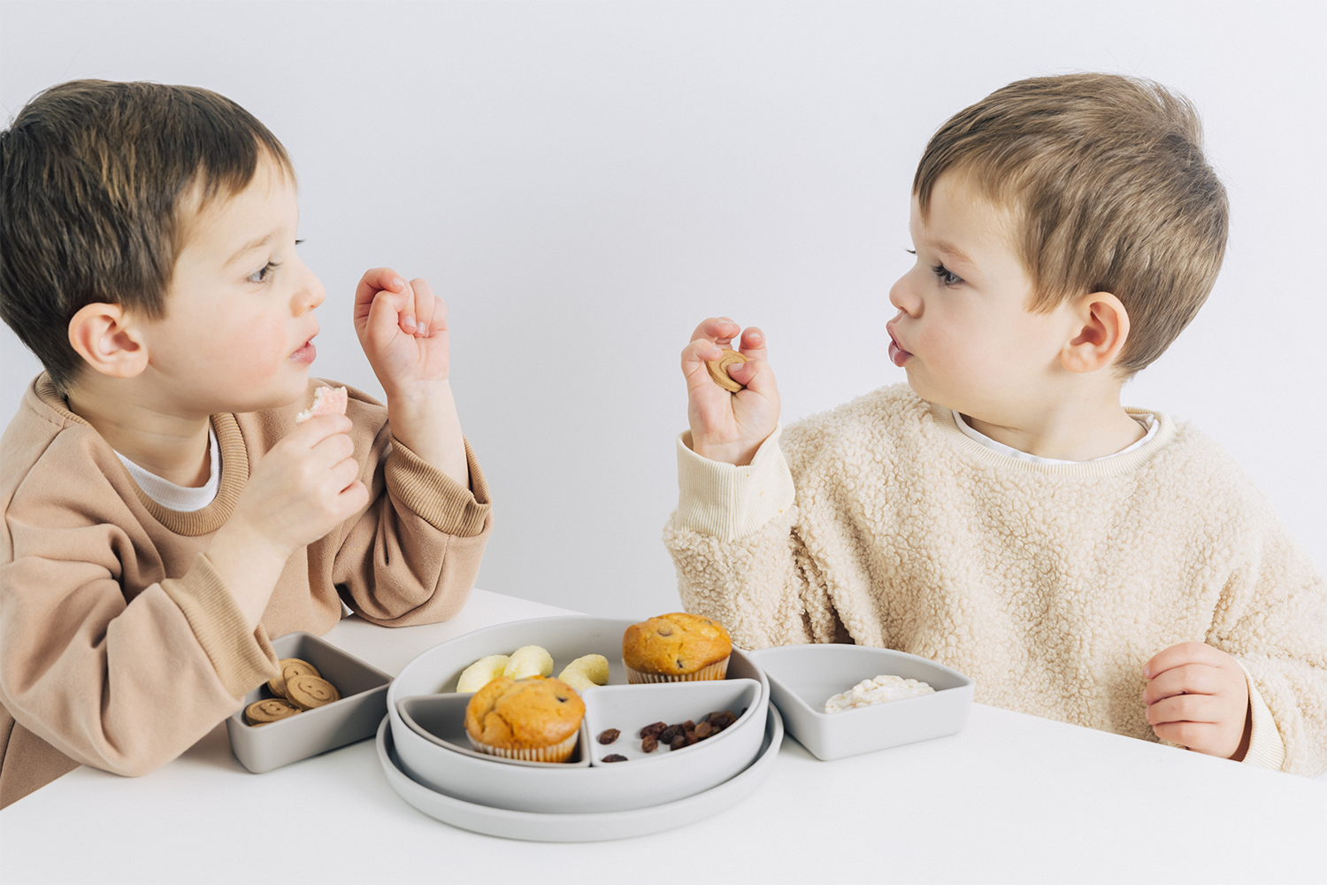 Kids Silicone Multi-functional and Multi-use Tableware with two little boys eating together at a table.