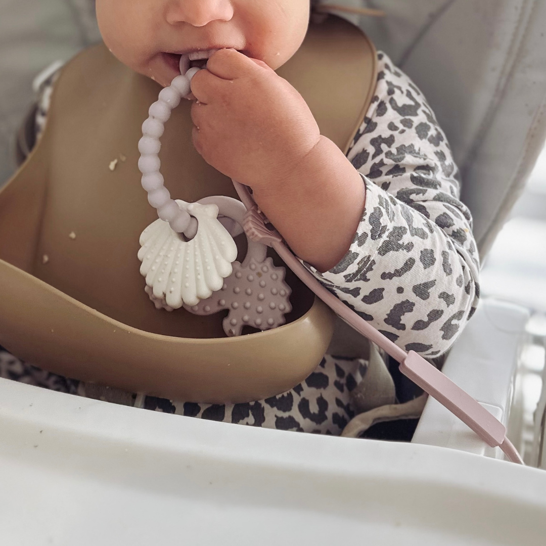 Baby's teether by Baby by Beach on a silicone strap.